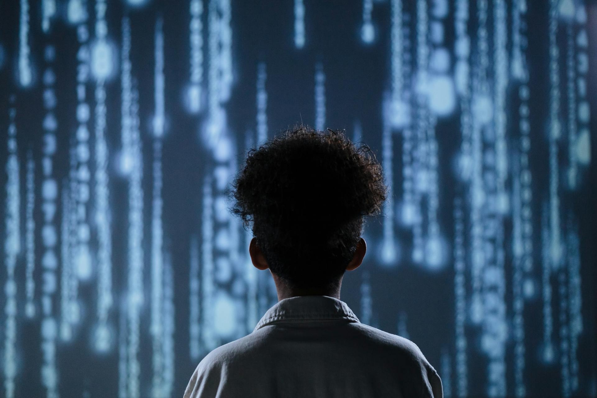 Boy_facing_code_matrix